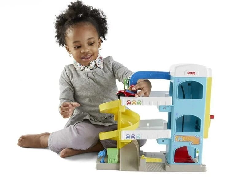 Fisher-Price Little People Helpful Neighbor’s Garage Toddler Playset with 2 Wheelies Cars