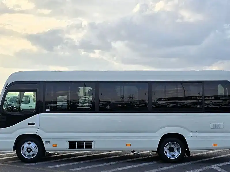 2026 Toyota Coaster VIP 4.2l diesel MT 22 Seats Electric Door White Brown
