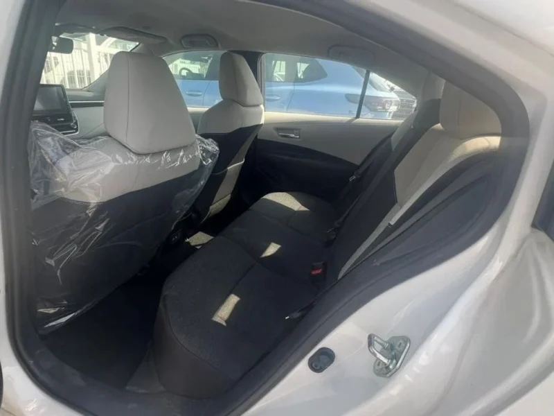 2023 TOYOTA COROLLA 1.6 Litres 4 Cylinders Petrol Engine White Beige Sedan