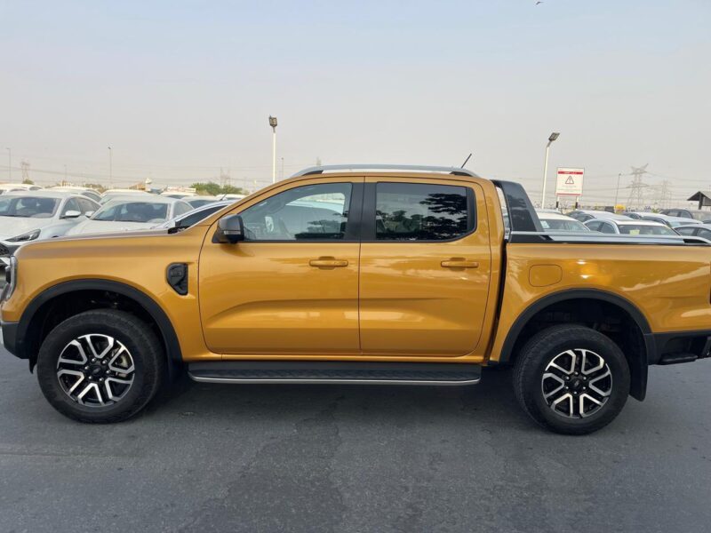 The 2023 Ford Ranger Wildtrak 2.0L Bi-turbo Diesel 4 Cylinders Yellow Black Pick Up Truck