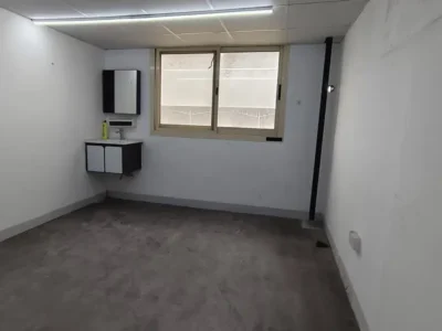 SPACIOUS MEZZANINE FLOOR UNIT WITH WINDOWS AND WASHBASIN WITH A WIDE ENTRY ACCESS