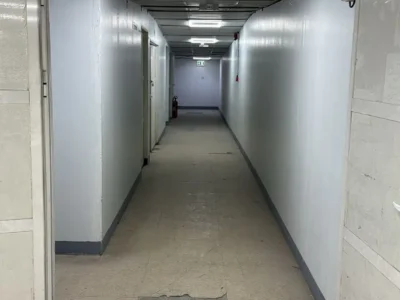 SPACIOUS MEZZANINE FLOOR UNIT WITH WINDOWS AND WASHBASIN WITH A WIDE ENTRY ACCESS