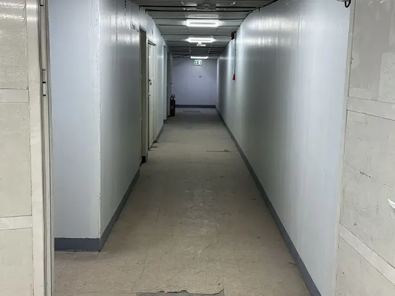 SPACIOUS MEZZANINE FLOOR UNIT WITH WINDOWS AND WASHBASIN WITH A WIDE ENTRY ACCESS